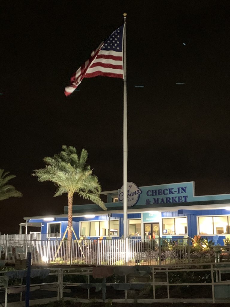 Cabana Club's market lit up at night.